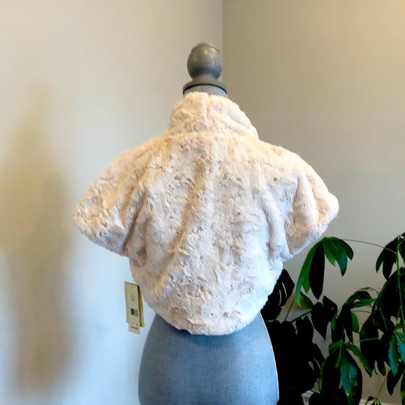 NWT- Make a statement with this beautiful bolo shrug, that is luxuriously soft. - Picture 1 of 8